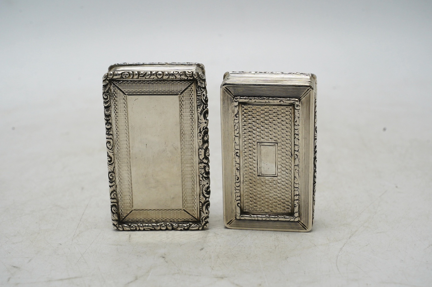 Two late William IV engine turned silver rectangular snuff boxes, Francis Clark, Birmingham, 1835/6, largest 70mm. Condition - fair